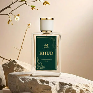 Khud perfume bottle 50ml with floral design, displayed on stone with natural light